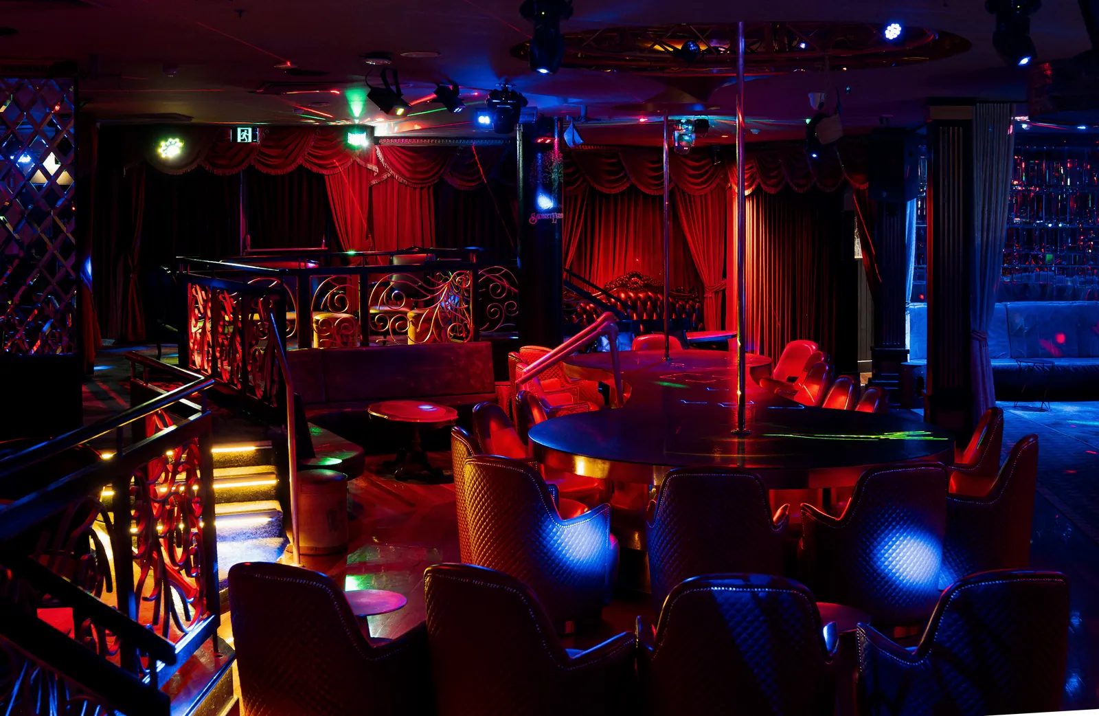 The main floor and stage framed by red velvet curtains